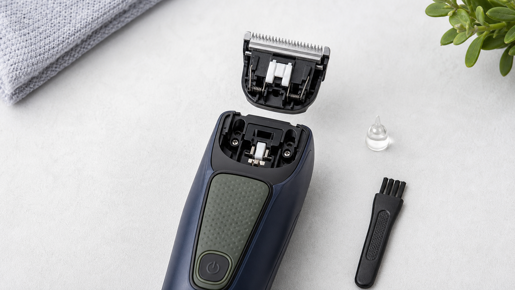 Generic beard trimmer with its replacement blade aligned above the mounting point